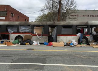 A burned out bus, part of a set for "Cordon" filming in Atlanta on Edgewood Avenue