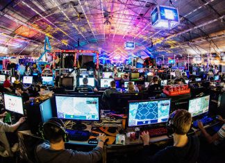 A room filled with people playing computer games