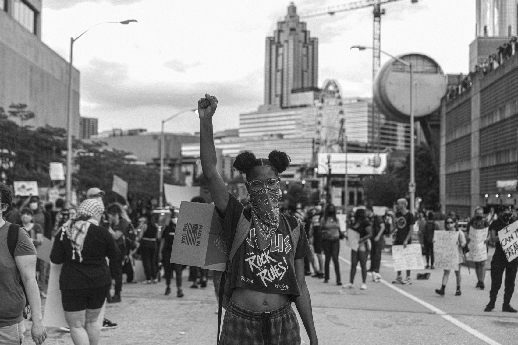 young female protestor with fist in the air