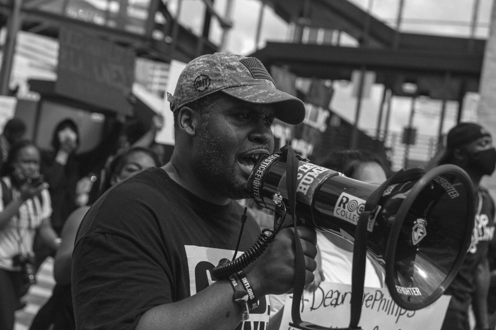 protestor speaking into bullhorn