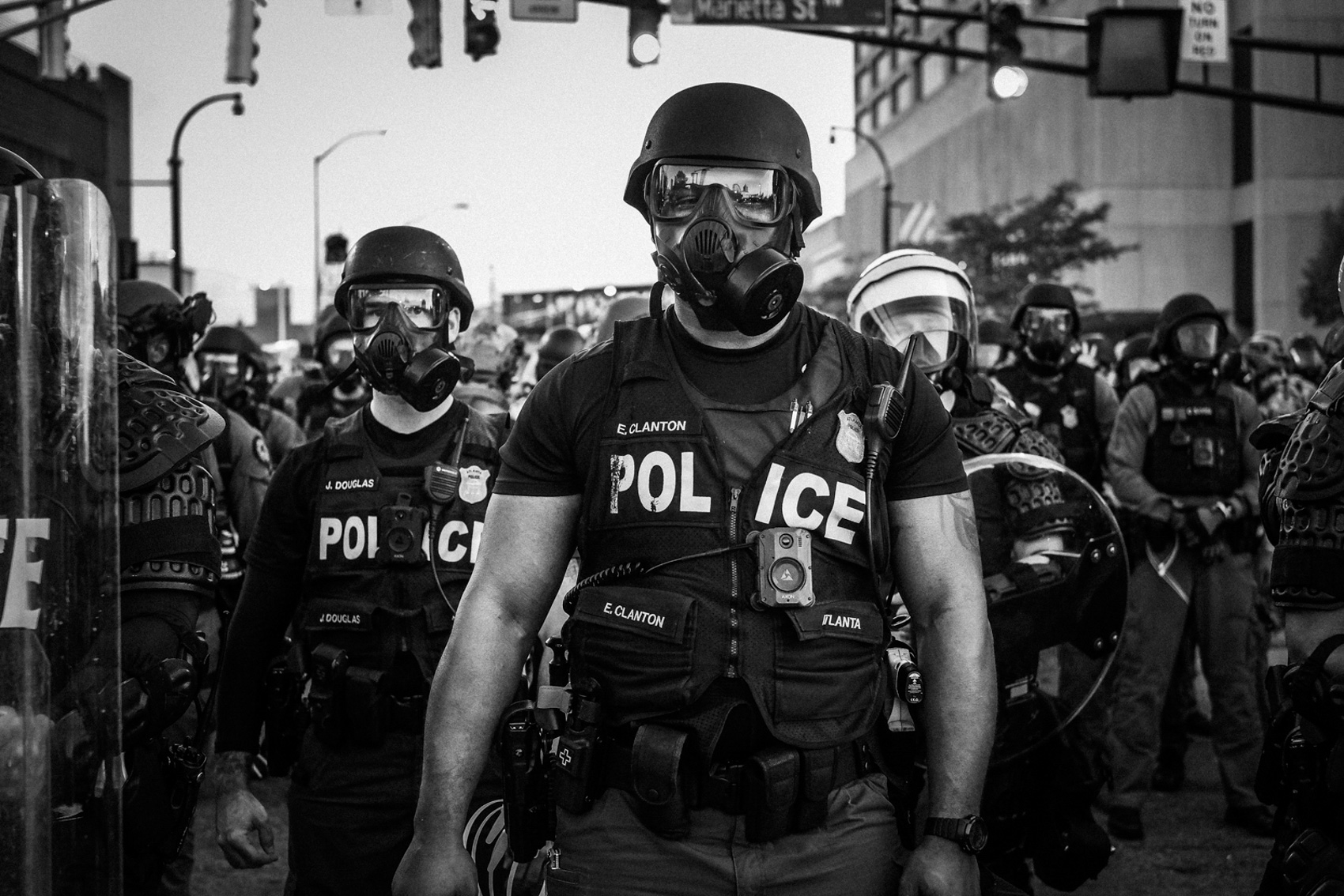 many police officers in gas masks