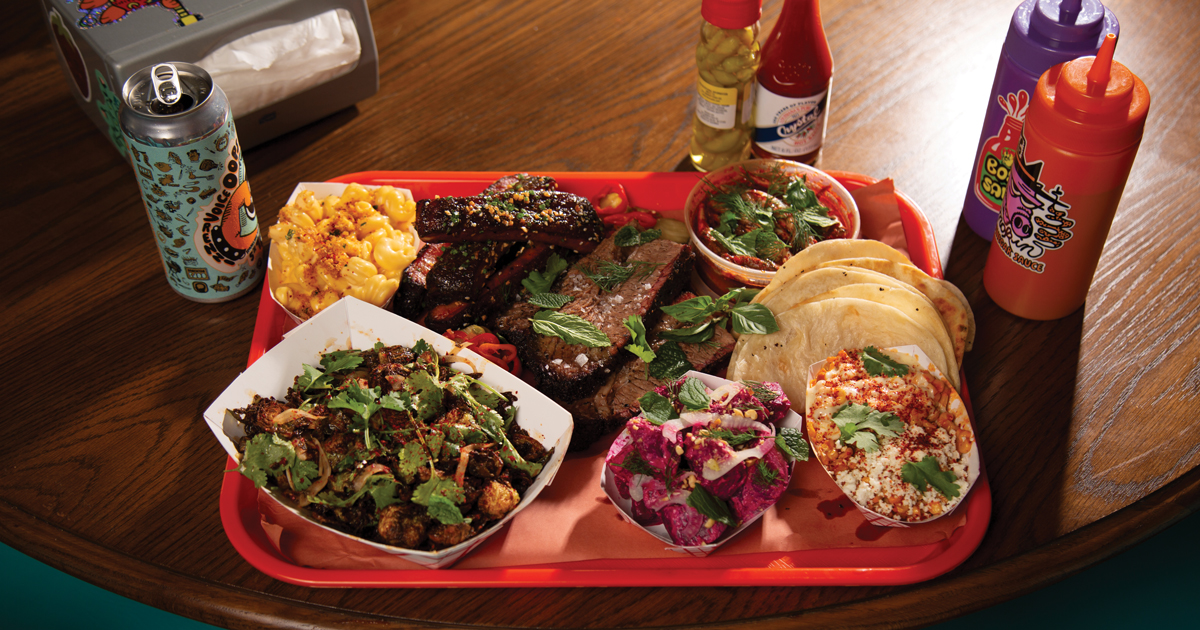 Brisket, mac and cheese, beet salad, creamed esquites, and brussels sprouts.