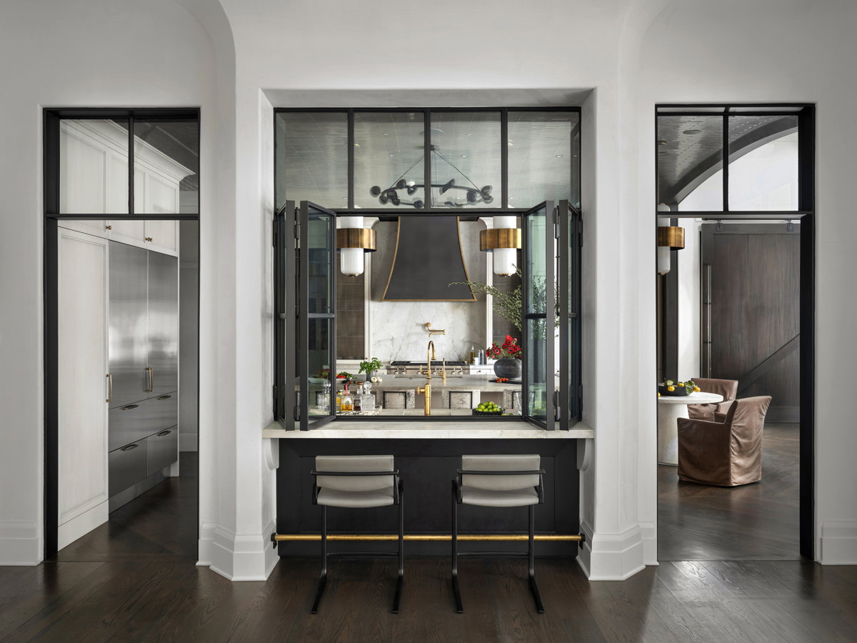 White marble kitchen with a black roof and gold accents