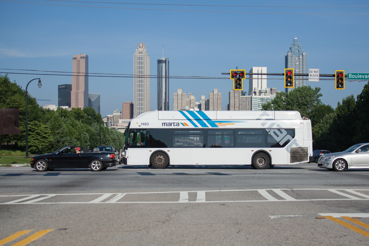 A MARTA bus on Boulevard with the Atlanta city skyline in the background