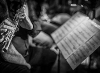 Protecting artists, from freelance to city orchestras, the Atlanta Federation of Musicians makes sure the music is valued A flute player reading sheet music in an orchestra