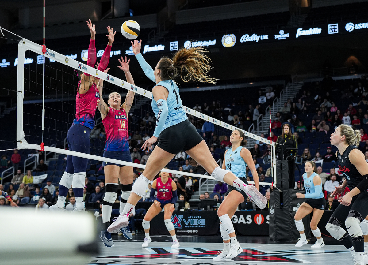 An Atlanta Vibe spikes the ball over the net