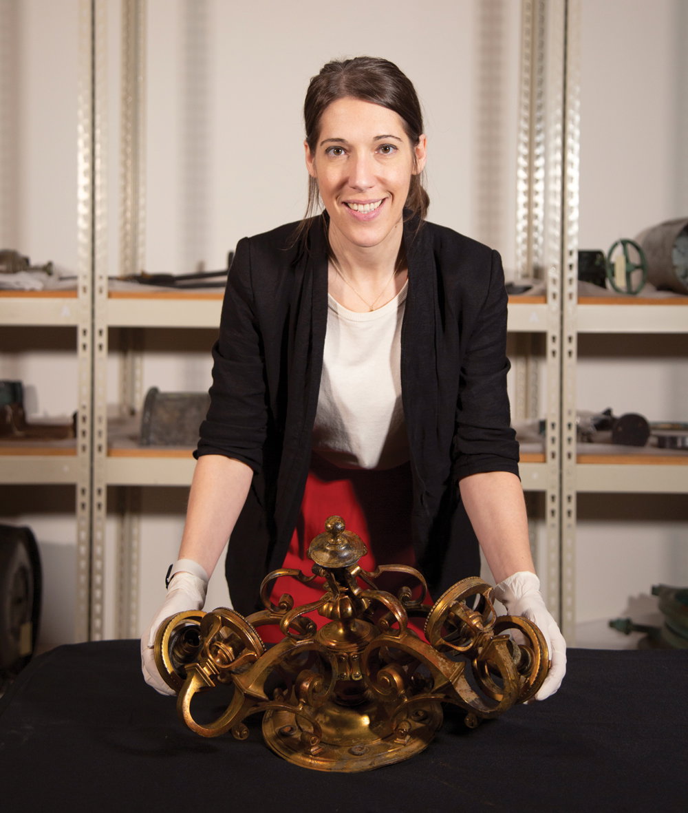 Tomasina Ray, RMS Titanic, Inc. president, with a recovered chandelier