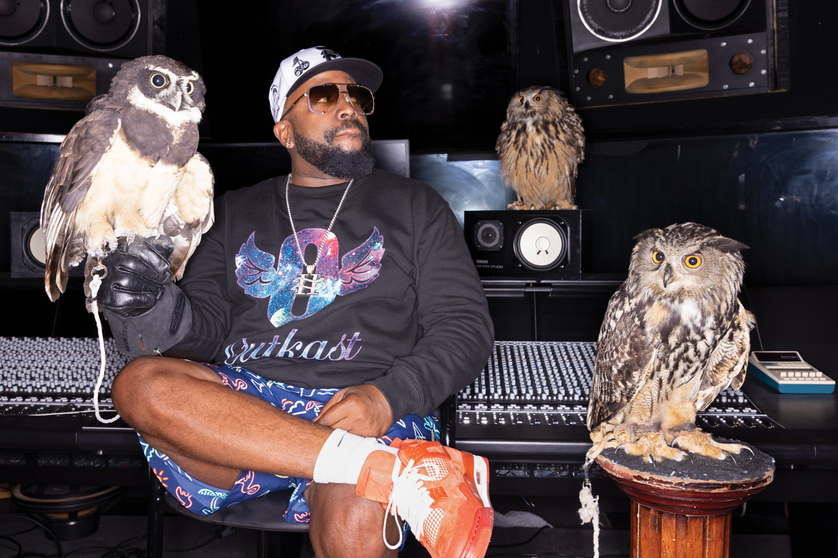 Big Boi sits in the recording studio with 3 owls (from left) Tula, HOO-Dini, and Hootie.