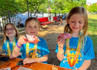 Four decades of music and art at Virginia-Highland Summerfest Kids show off their handmade crafts after running in the Virginia-Highland Summerfest Tot Trot.