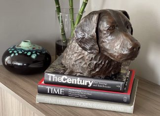 21 places to eat, shop, and hike with your pet in Atlanta one of Dorri Buchholtz's dog artworks sits a top some books