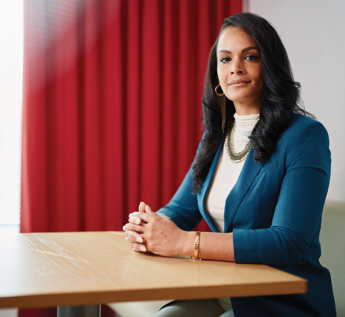 Tiffany Kirk sits at a table