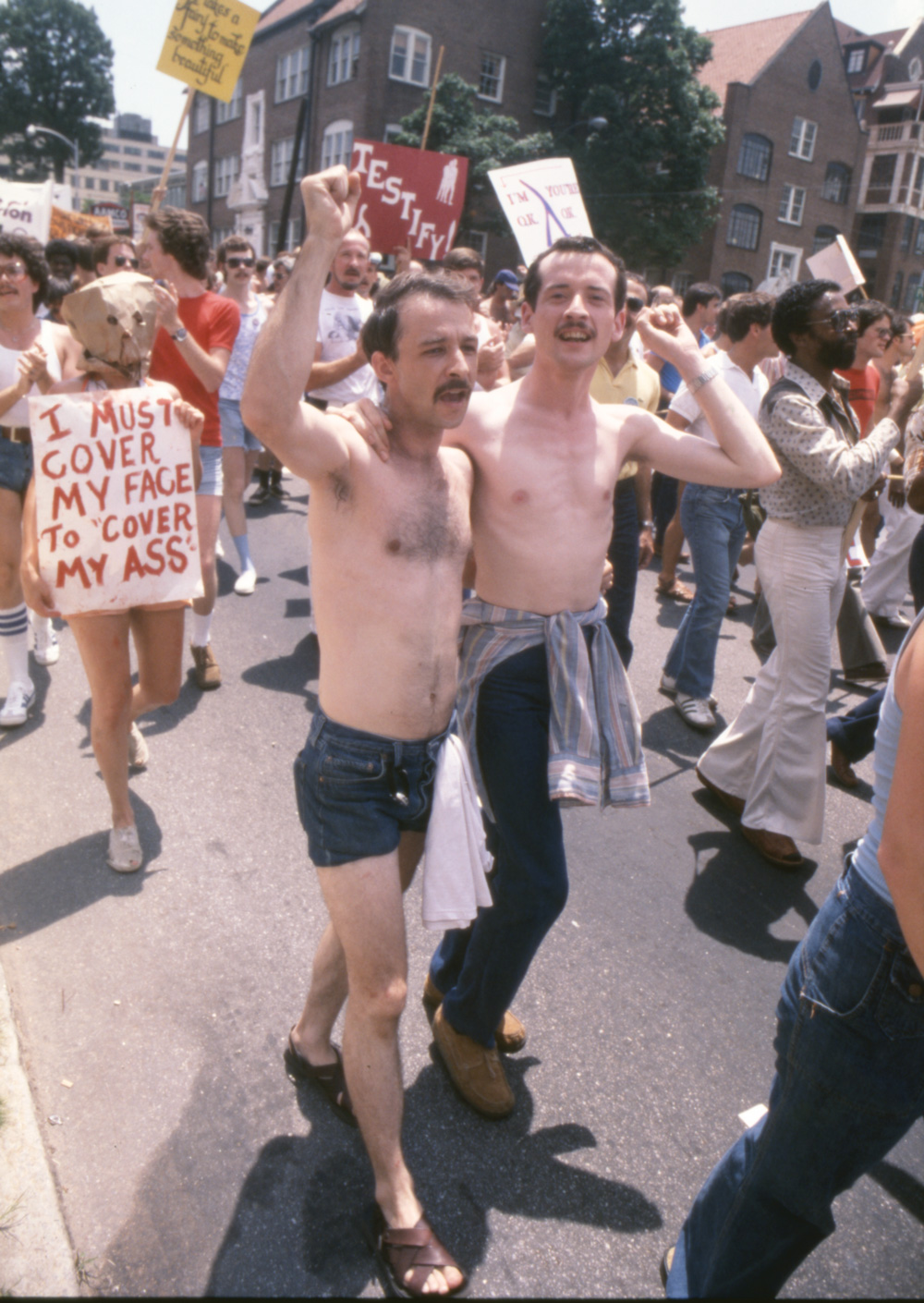 Pride marchers, one with a bag concealing their face, during the Atlanta Pride Parade in 1977