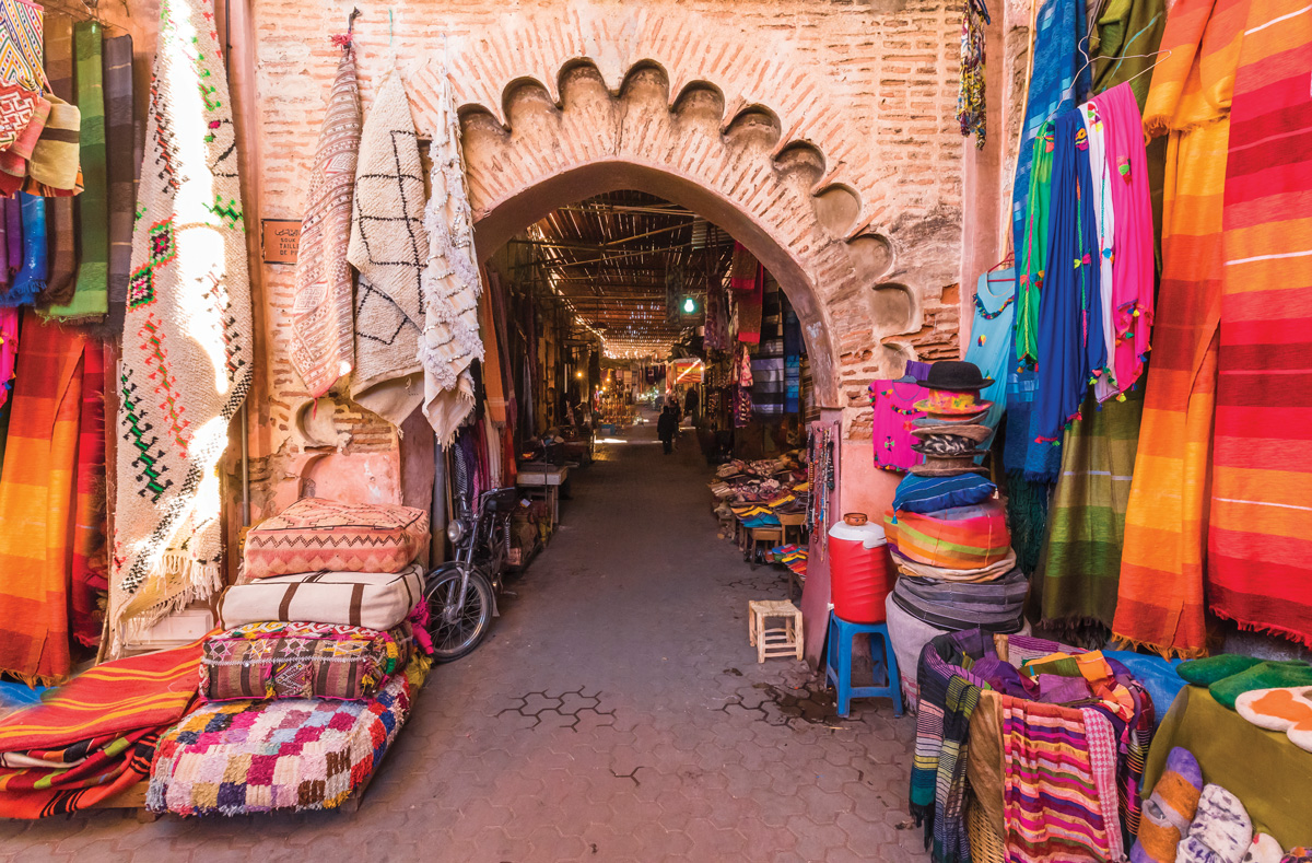 A street fillled with textiles for sale in Marrakech, Morroco