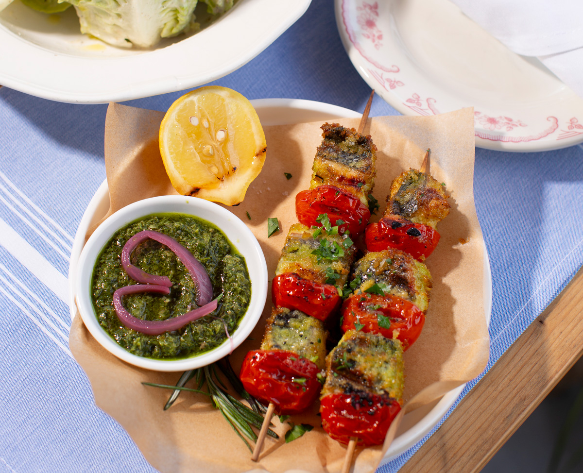 Sunny seafood skewers with salsa verde and charred lemon on Yeppa & Co.’s patio
