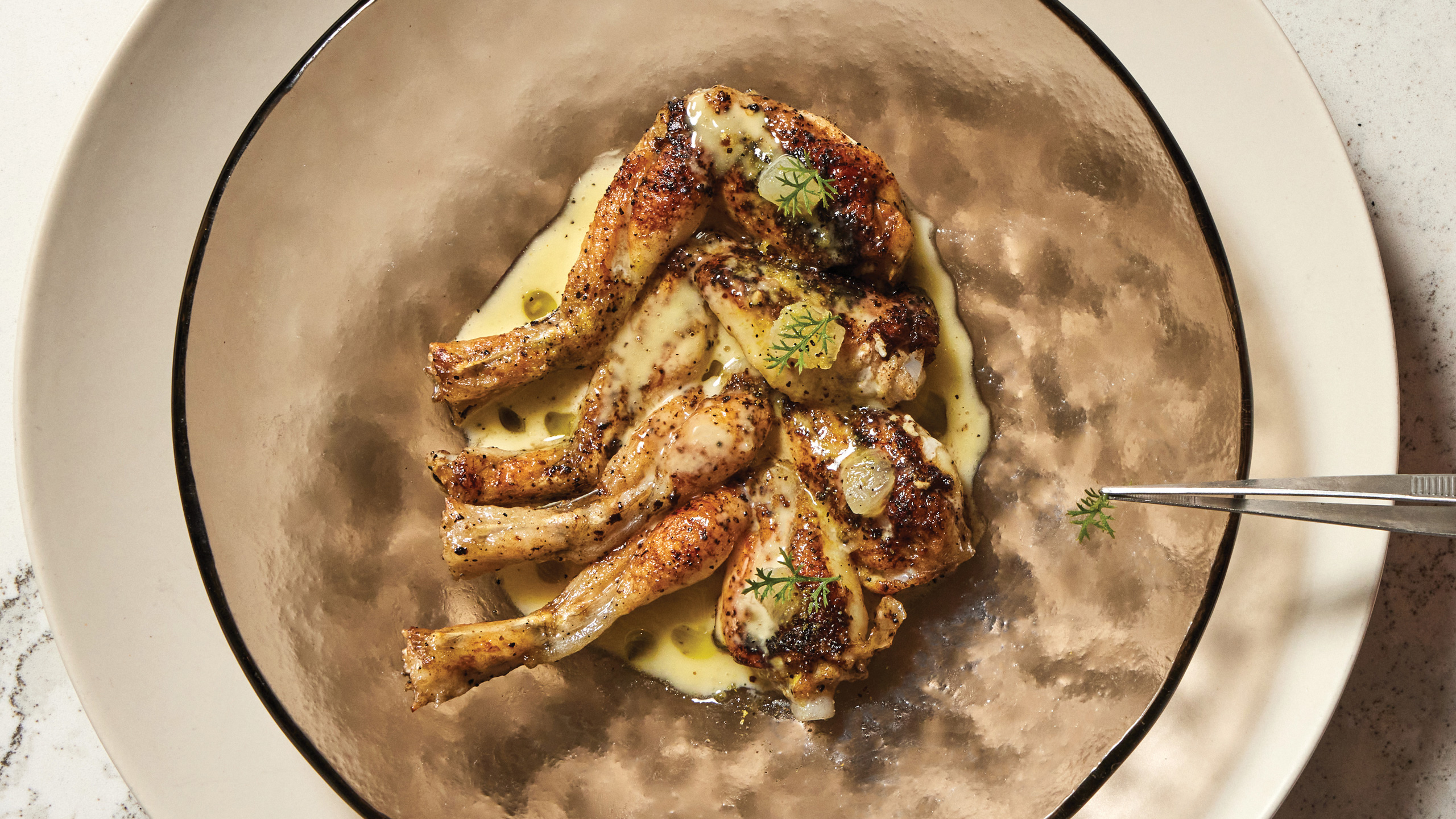 Frog legs, lemon pepper wet, at Avize