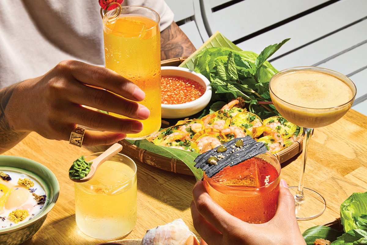 Toasting with the Moon Theory (left) and Sabai Sabai cocktails at Side Quest