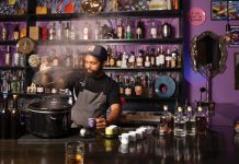 Getting Buddy Buddy at Midtown’s coziest new bar a bartender mixes drinks at Buddy Buddy