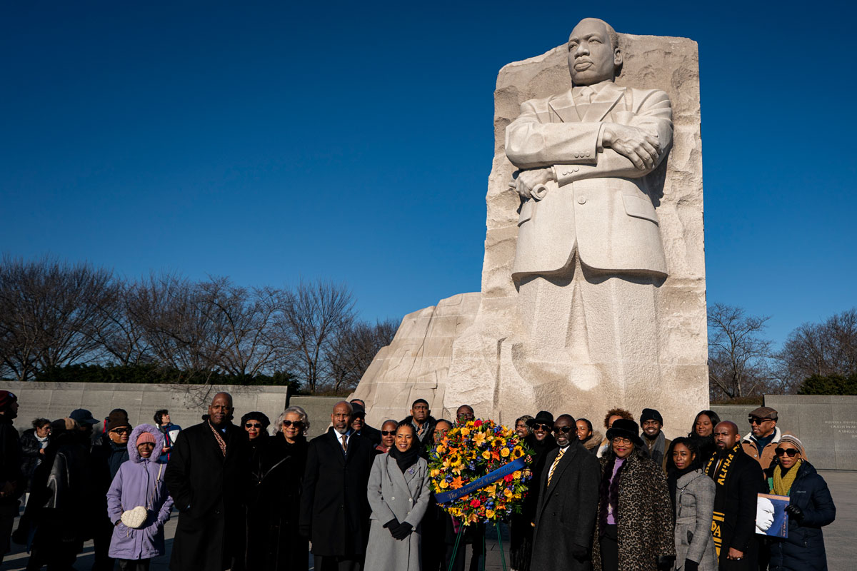 Sen. Angela Alsobrooks (D-MD), in grey coat, and faith leaders lay a wreath during a celebration of Martin Luther King Jr. Day at the Martin Luther King, Jr. Memorial on January 19, 2026 in Washington, DC.
