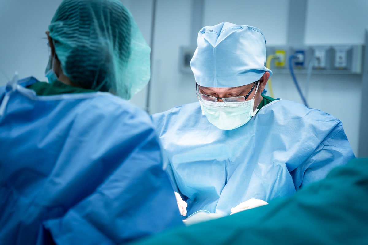 Close up face of Surgeons working surgical stitches are in progress during Operation
