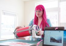 At Posy Press, students learn the imperfect art of making risographs Richardson loading the risograph ink drum