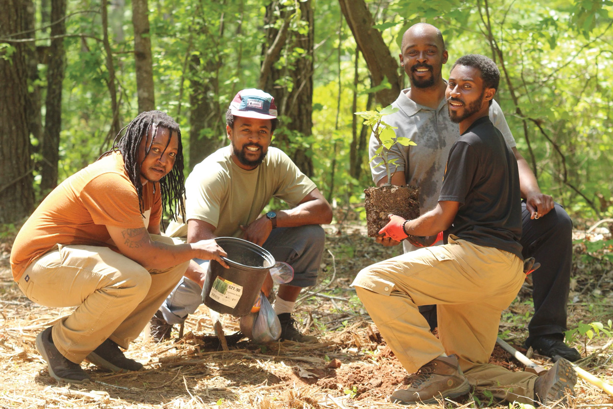 Members of the Ashe Legacy Family Farm team (from left) Carlous Moore, Myles Gaines, Todd Alford, and Noah White