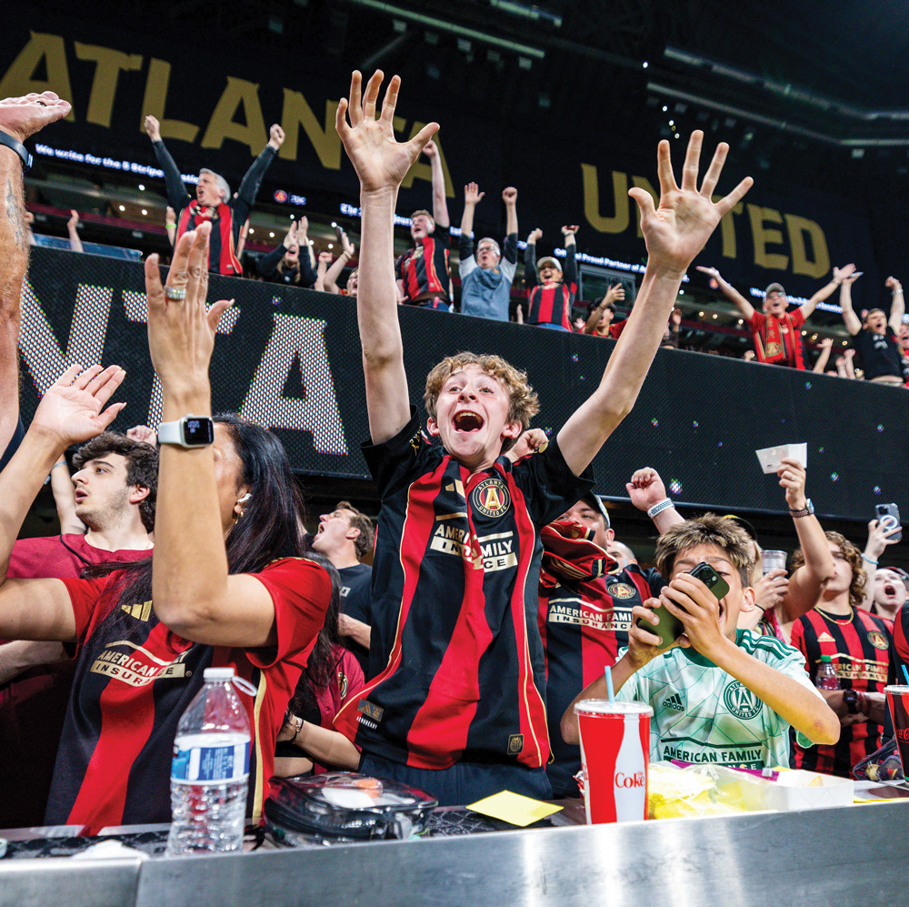 Atlanta United fans excitedly cheer on the team