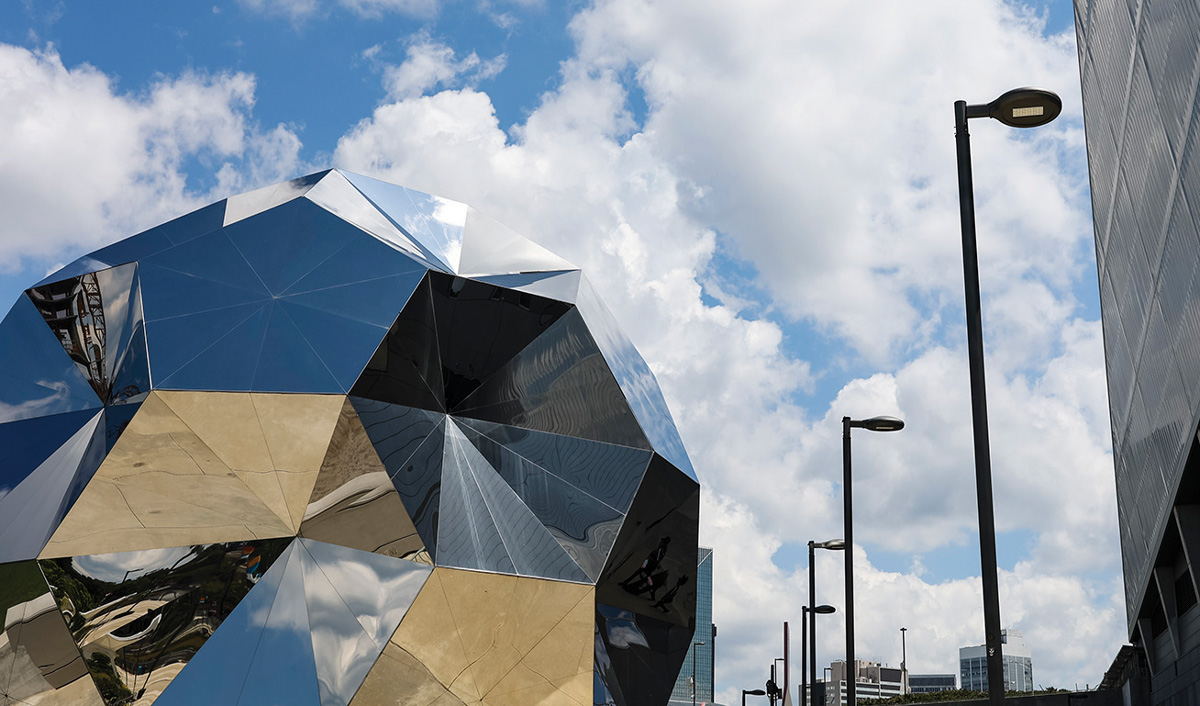 a reflective ball sculpture outside the stadium