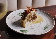 Mirae in Brookhaven blends Korean tradition with modern ambition A half cut piece of cabbage with a glass of white wine next to it