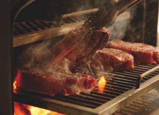 Fired Up Grilling steaks on Emberhaus Fire Oven
