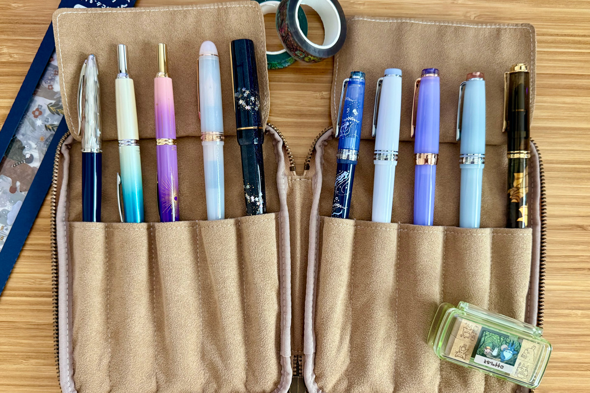 Club member Emily Wong’s collection of fine pens, tucked in a tan suede zipper case