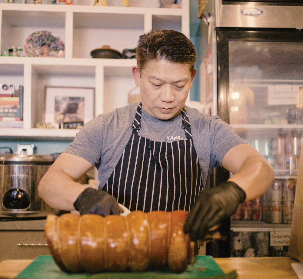 Carlo Gan preparing rolled pork roast at Kamayan ATL
