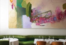 An abstract painting by Tommy Taylor defines the main dining room
