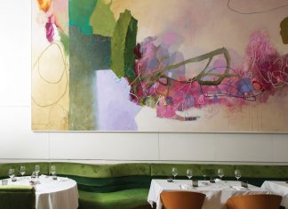 An abstract painting by Tommy Taylor defines the main dining room