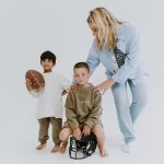two kids model the Positionless clothing next to Kristen Ledlow