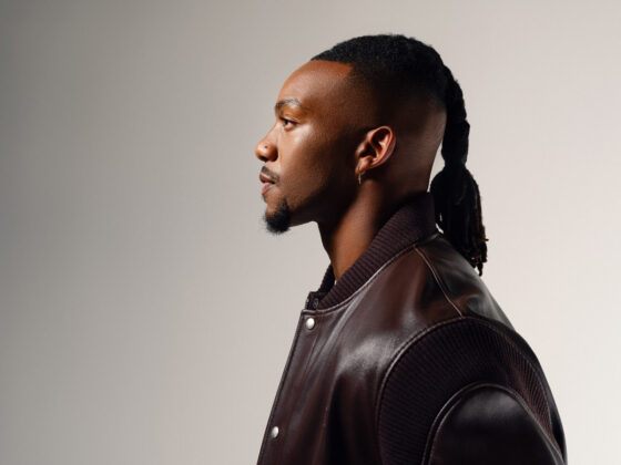 Bijan Robinson poses for the camera in a jacket by Loewe