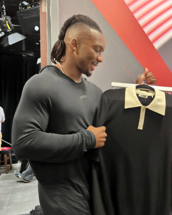 Bijan Robinson holds a Sandro polo