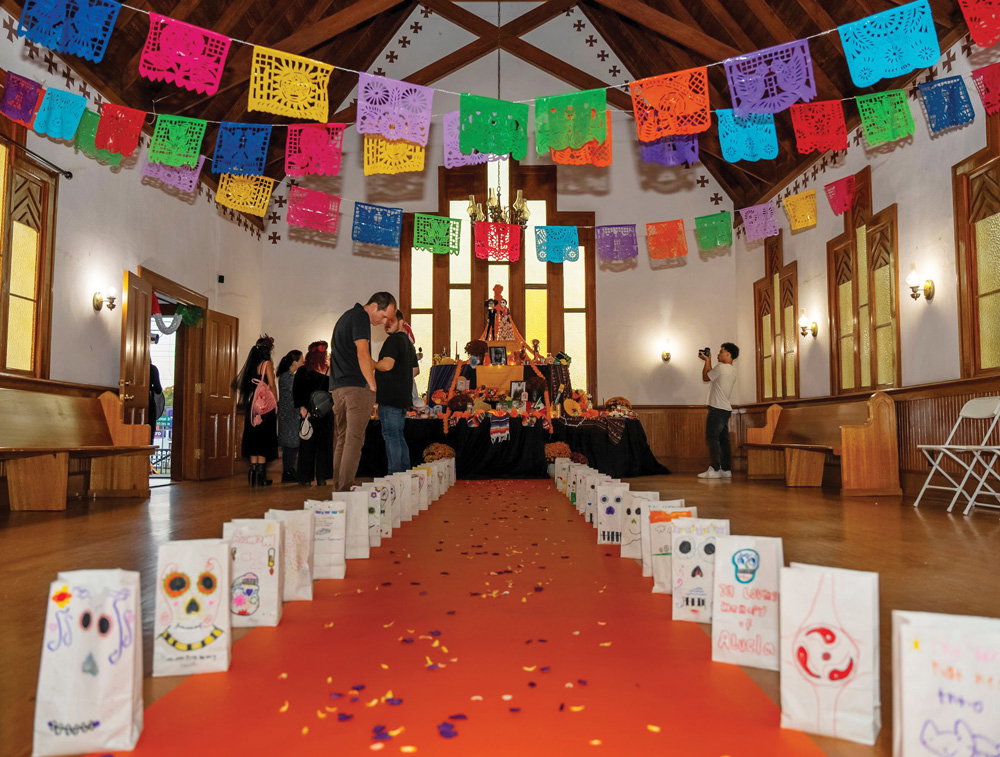 the inside of a church is decorated for Día de Muertos Celebration