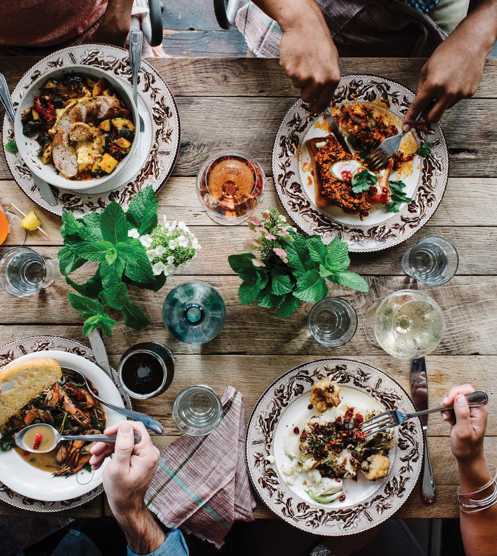 an array of dishes over a rustic table