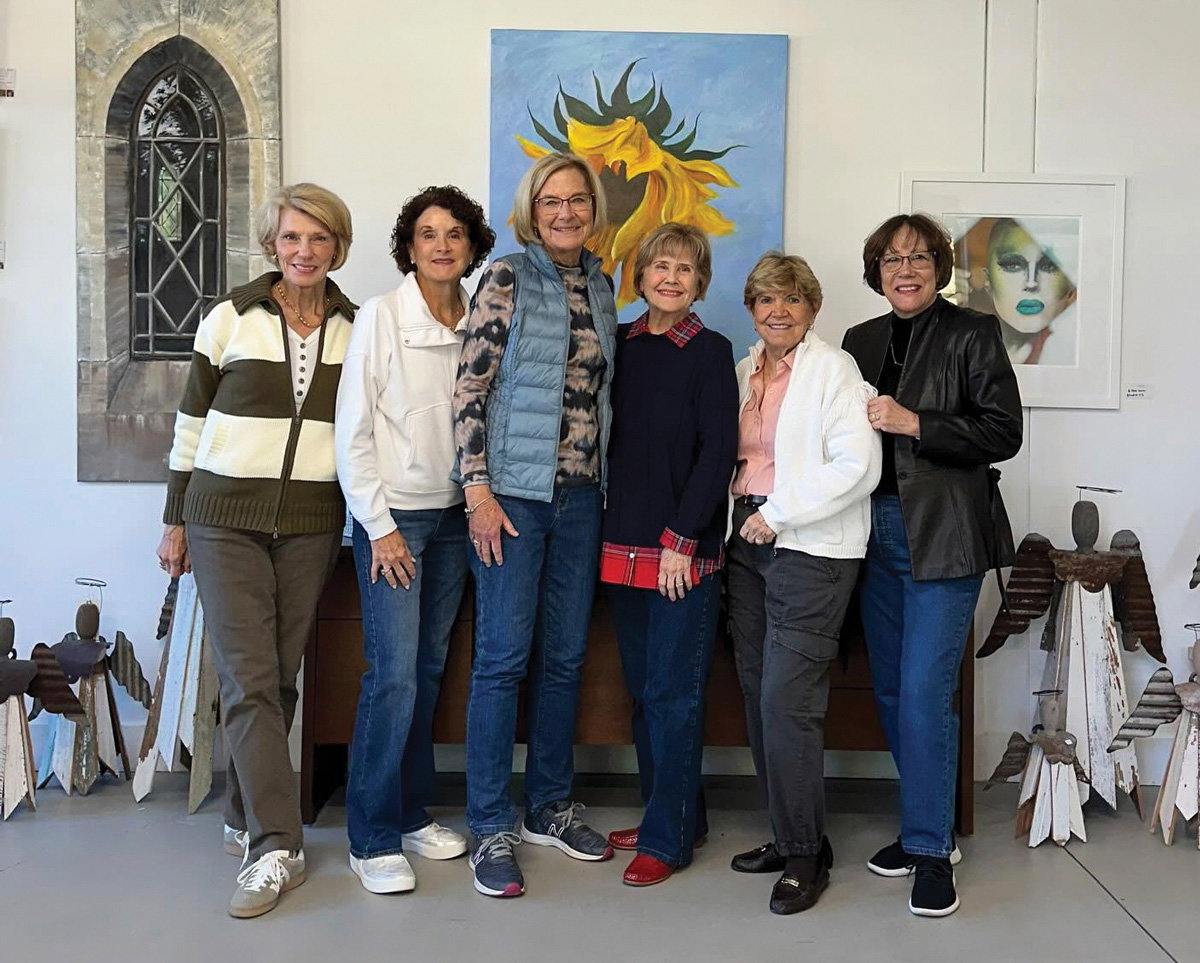 A gropu of women gather an smile for the photo at the Fall Art Walk