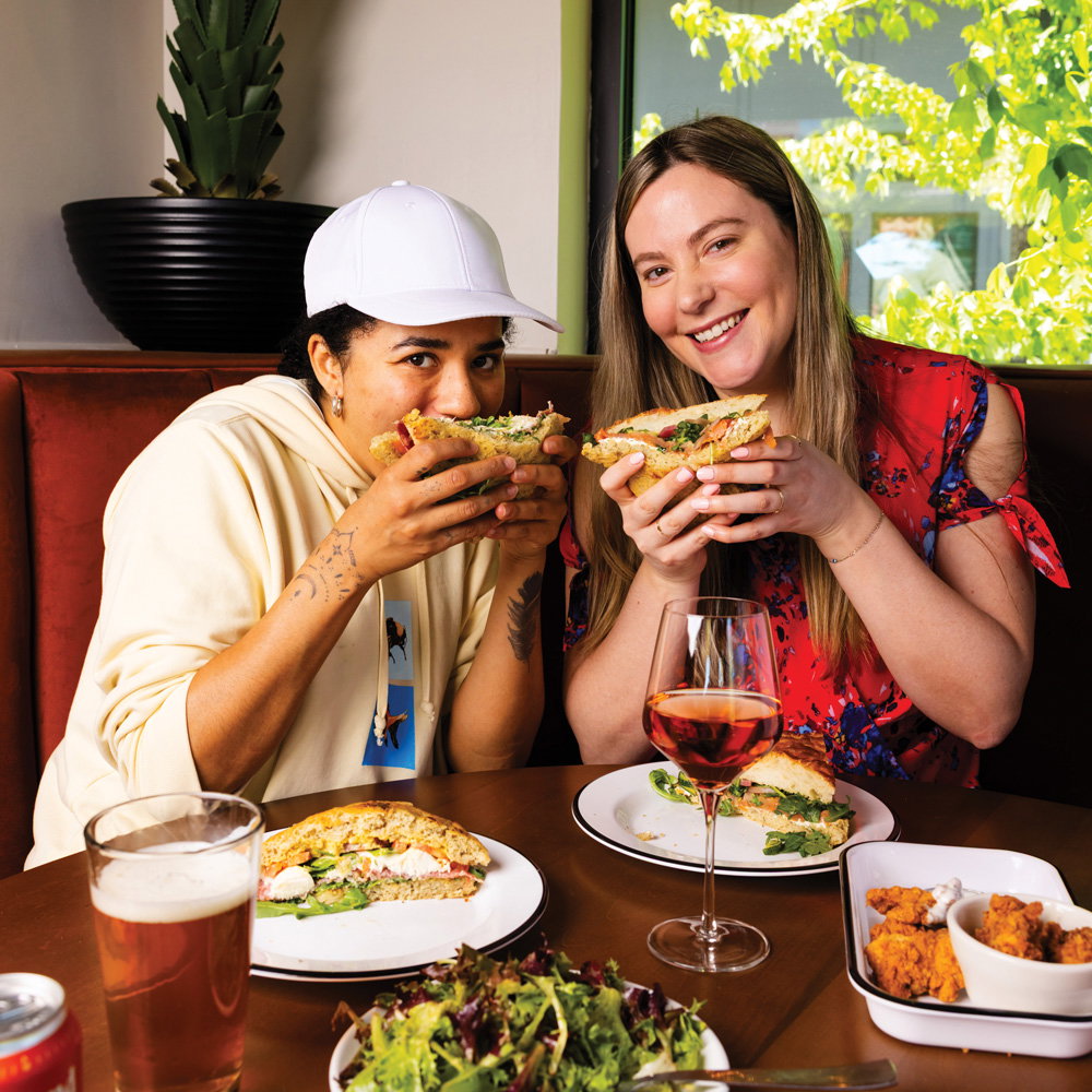 two people enjoy the food at Side Saddle Wine Saloon & Bar