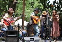 6 Atlanta Neighborhoods Where Community is Key: Ormewood Park a band plays on stage at the Ormewood Park Makers Festival