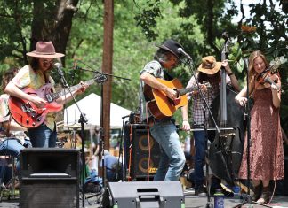 6 Atlanta Neighborhoods Where Community is Key: Ormewood Park a band plays on stage at the Ormewood Park Makers Festival