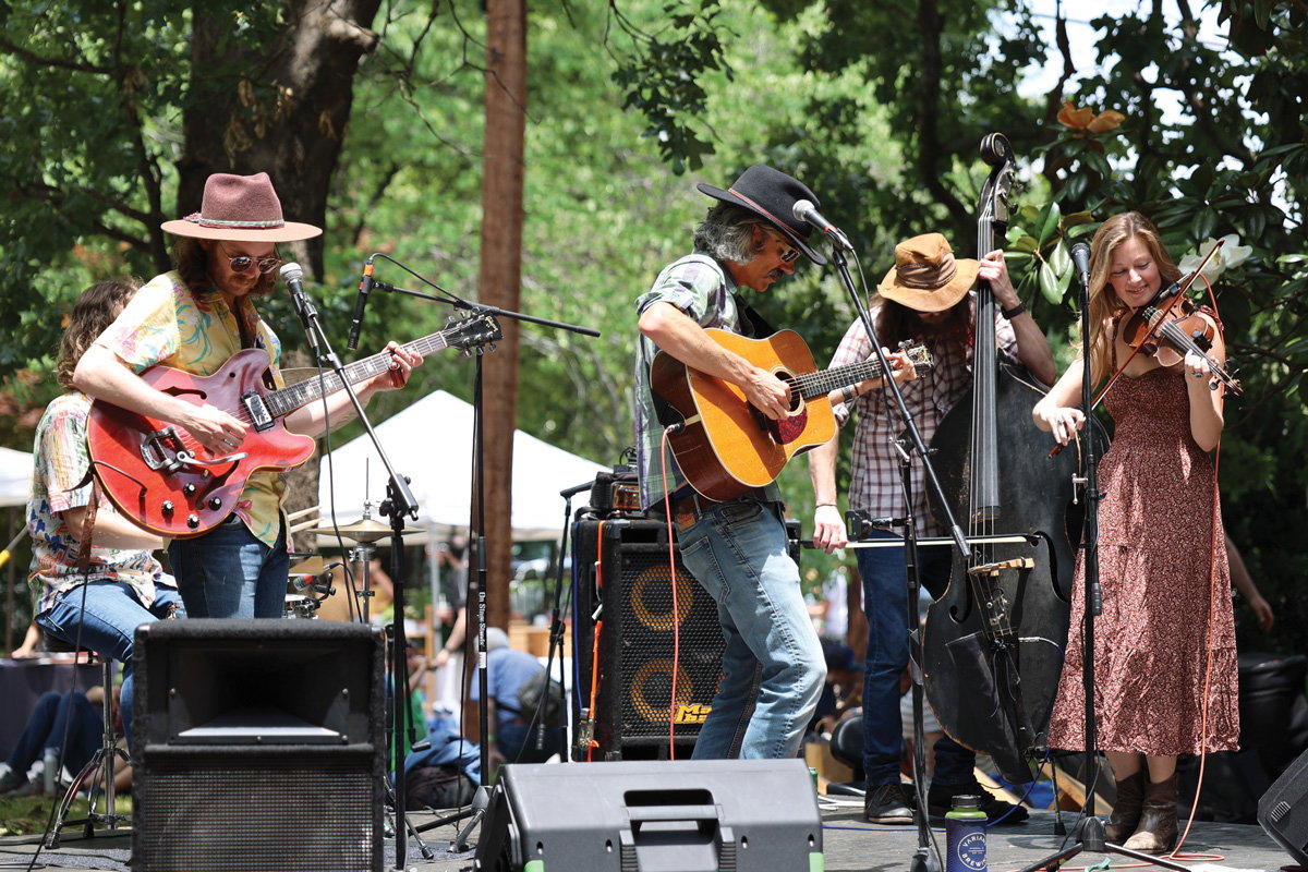 a band plays on stage at the Ormewood Park Makers Festival