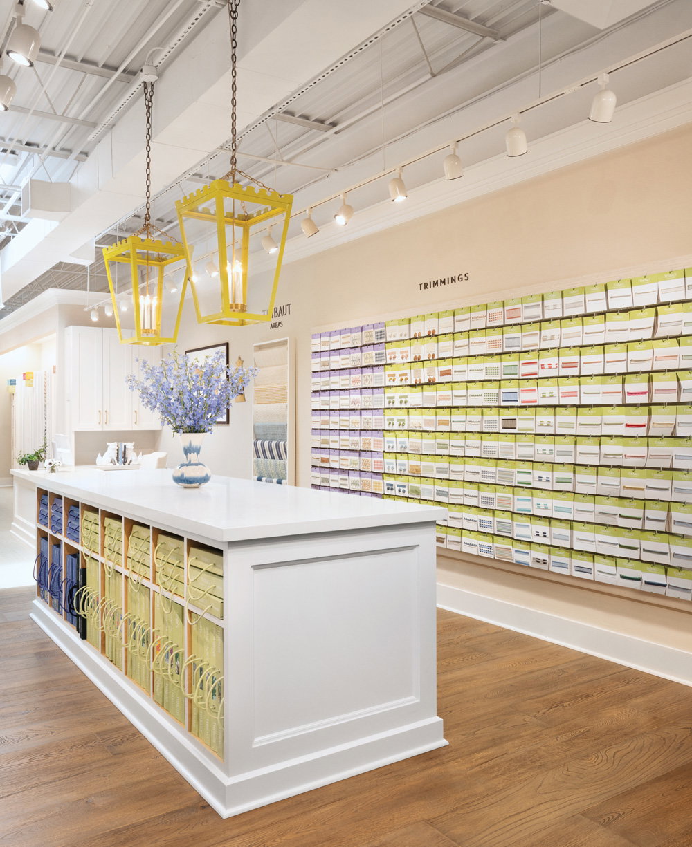 the inside of the showroom features a wall with samples to look through