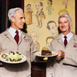 Atlanta’s 10 Best Steakhouses: Bones A server, Aaron, and John Wenger smile and hold plates of food