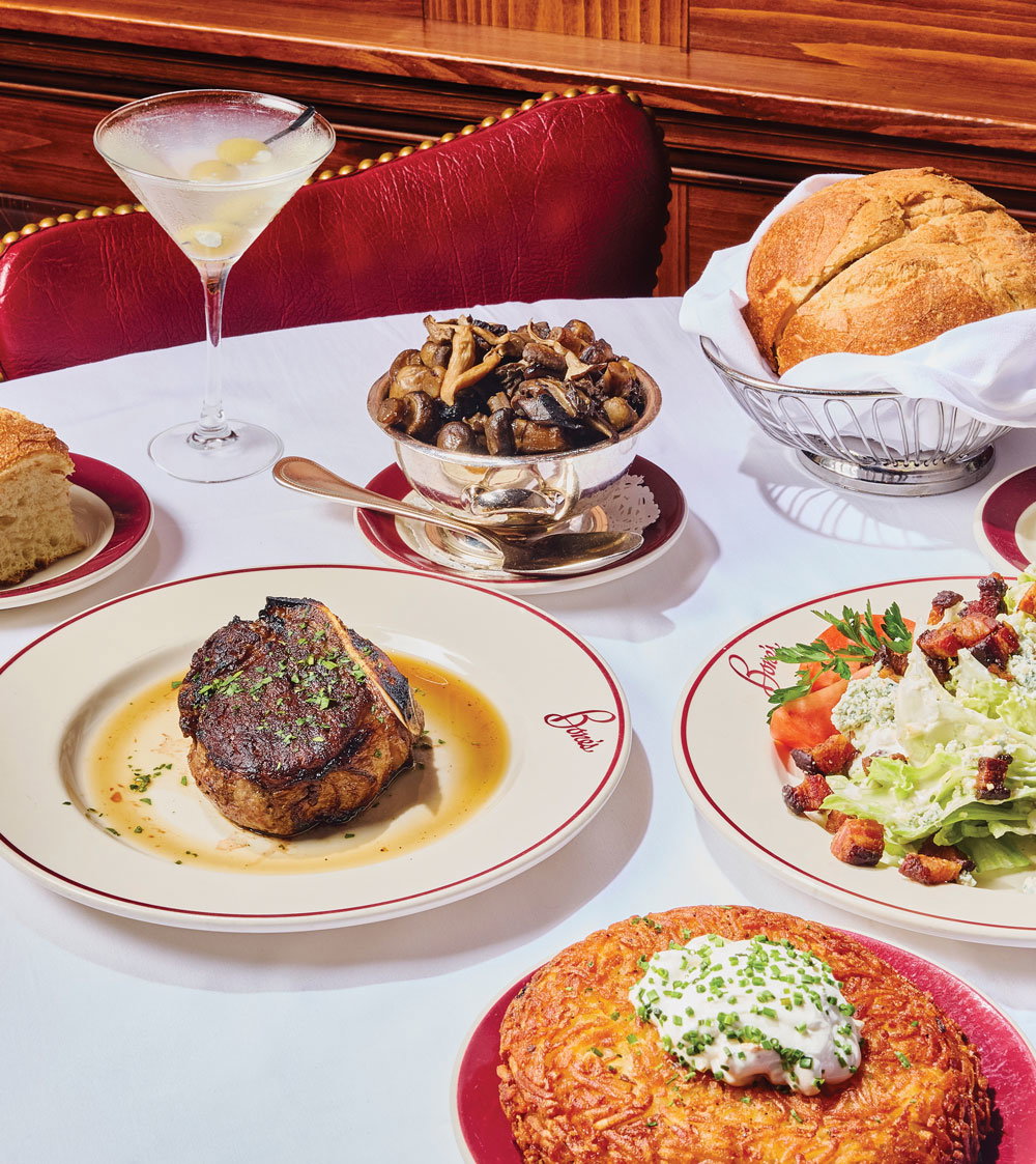 Plates, bowls, and cocktails on a dining table
