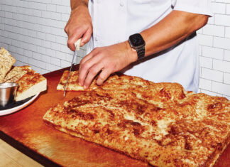 Peter Kaiser cuts bread
