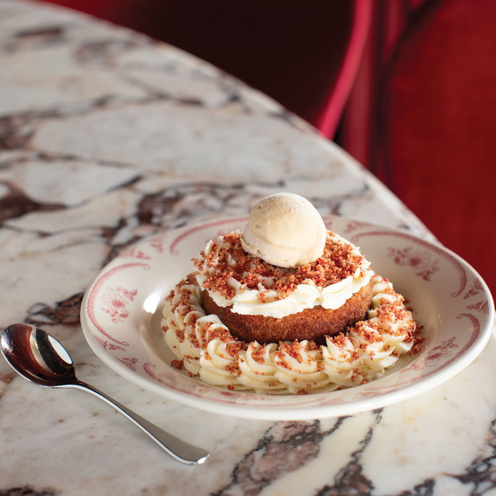 A dessert topped in frosting