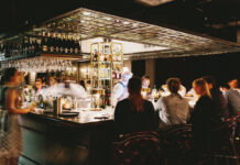 Atlanta’s 10 Best Steakhouses: Marcel Patrons sit at a square bar