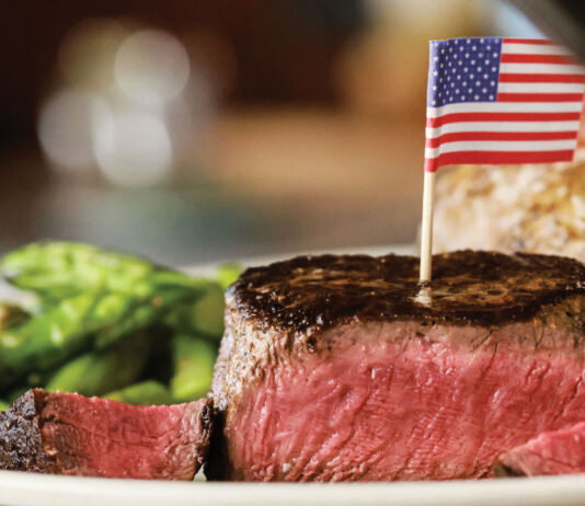 7 Atlanta restaurants where a steak won’t break the bank A medium rare steak with a U.S. flag toothpick in it from Ted’s Montana Grill
